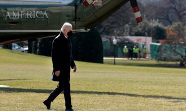 President Joe Biden walks on the South Lawn of the White House after returning on Marine One from Delaware on February 28