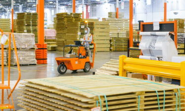 An employee works inside the Home Depot flatbed distribution center in Stonecrest