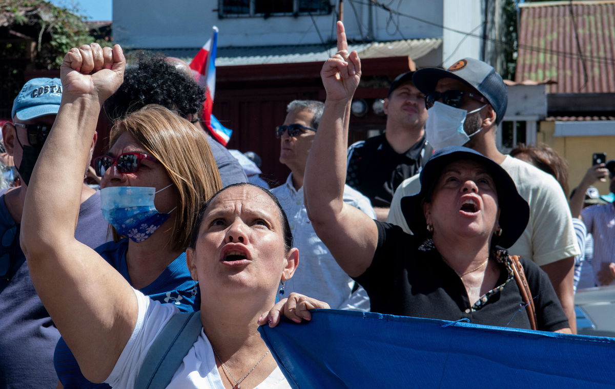 <i>Ezequiel Becerra/AFP/Getty Images</i><br/>People take part in a demonstration against the Covid-19 vaccination mandate for children in San Jose