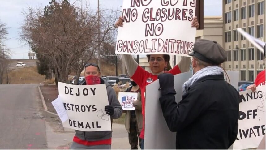 <i>KCNC</i><br/>More than a dozen workers from various post offices in the Denver metro area protested Wednesday as U.S. Postmaster General Louis DeJoy visited the Mile High City to speak with area supervisors.