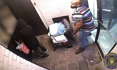 Police say an Asian woman was stomped on and punched more than 125 times in New York after being called a racial slur on March 11. Seen here is an image from the surveillance video from the attack.