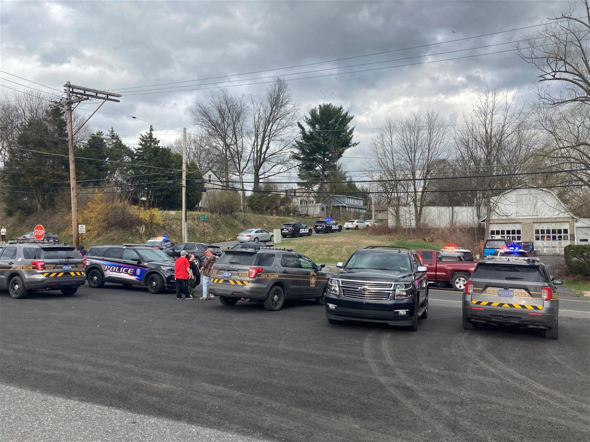 <i>Matthew Toth/Lebanon Daily News/AP</i><br/>Police gather near the scene of a fatal shooting in Lebanon