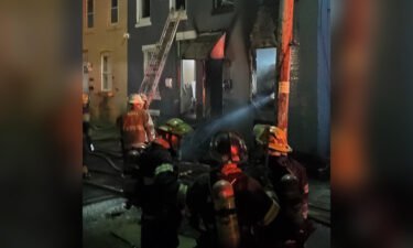 The scene of a house fire that killed a woman and three children is seen in this photo shared by the Philadelphia Fire Department on Sunday.