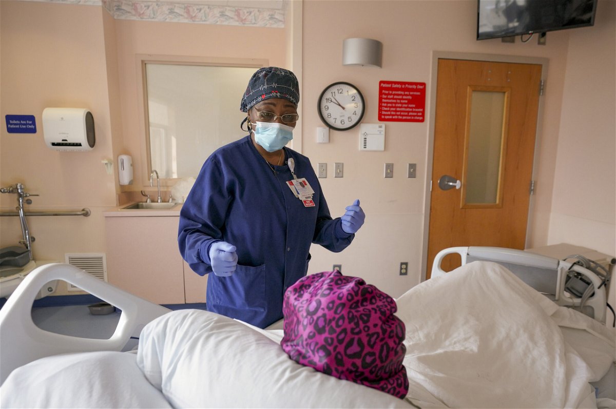 <i>Bonnie Jo Mount/The Washington Post/Getty Images</i><br/>Registered Nurse Mafereh Sesay speaks with a patient at Luminis Health Doctors Community Medical Center on March 16 in Lanham