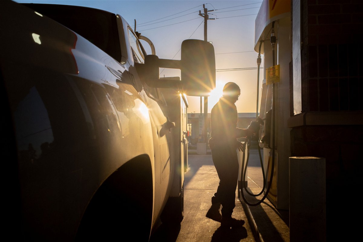 <i>Brandon Bell/Getty Images</i><br/>A person finishes pumping gas at a Shell station on April 1