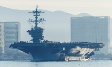 The USS Abraham Lincoln makes history as thousands of service members deploy from San Diego Naval Air Station North Island under Capt. Amy Bauernschmidt