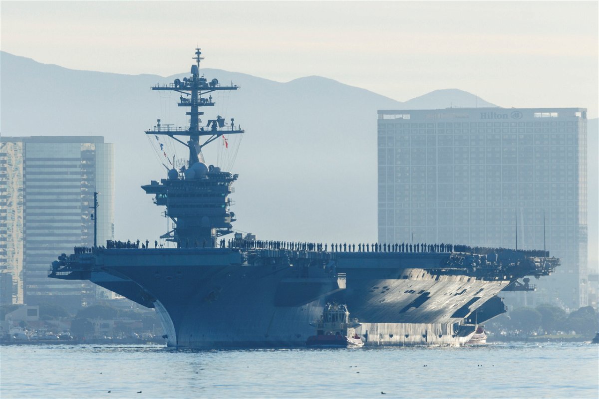 <i>Mike Blake/Reuters</i><br/>The USS Abraham Lincoln makes history as thousands of service members deploy from San Diego Naval Air Station North Island under Capt. Amy Bauernschmidt