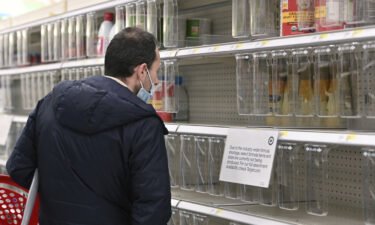 A man looks at a nearly empty baby formula shelves at a Target store in the Queens borough of New York City on May 10. The Biden administration is confronting a barrage of questions and criticism for the national baby formula shortage.