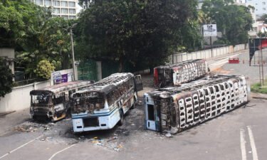 Burned buses near the official residence of Sri Lanka's outgoing prime minister Mahinda Rajapaksa in Colombo