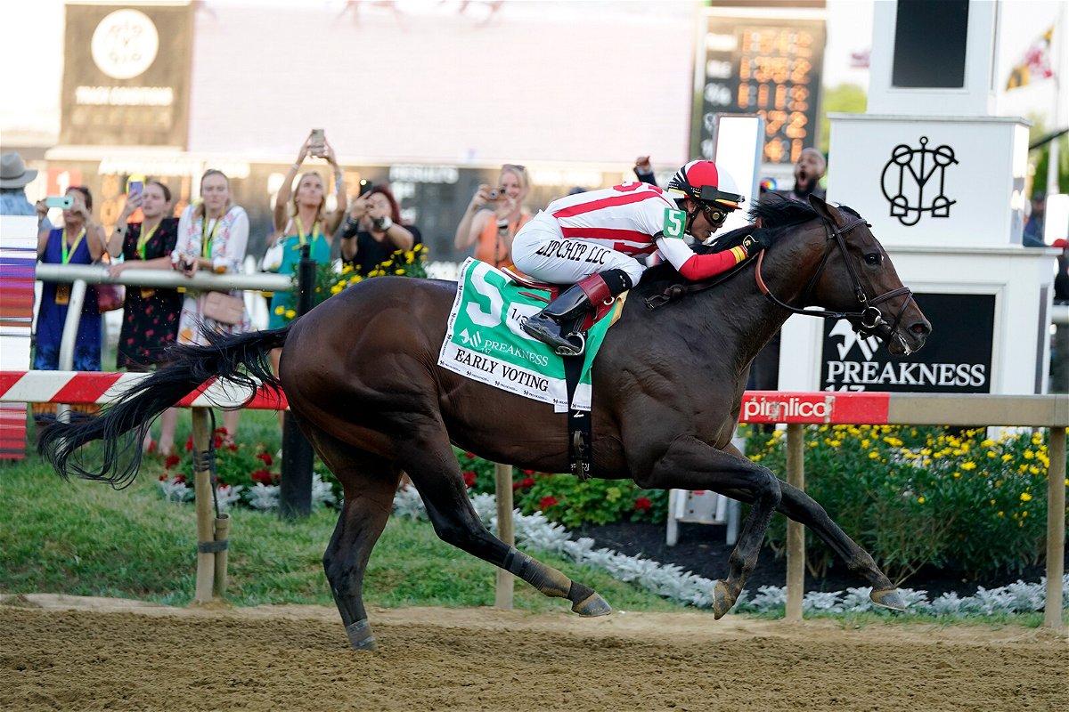 <i>Julio Cortez/AP</i><br/>José Ortiz atop Early Voting wins the 147th running of the Preakness Stakes horse race.