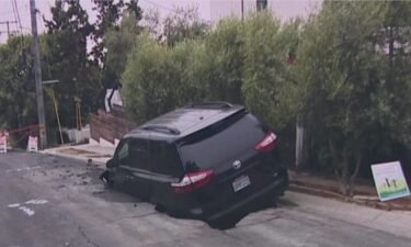 Crews with the East Bay Municipal Utility District responded to a neighborhood in the Berkeley Hills Wednesday night after a sinkhole formed and swallowed up a parked minivan.