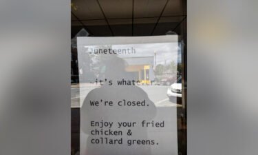 Photos show the sign taped to the window.