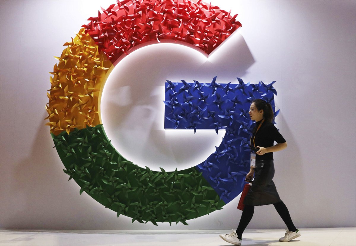 <i>Ng Han Guan/AP</i><br/>A woman walks past the logo for Google at the China International Import Expo in Shanghai