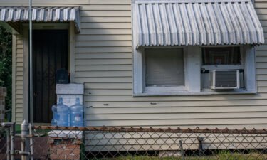 Empty water jugs are seen on a porch on June 10 in Houston