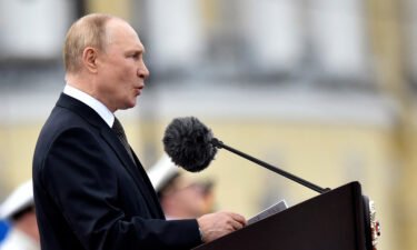Russian President Vladimir Putin delivers a speech marking Navy Day