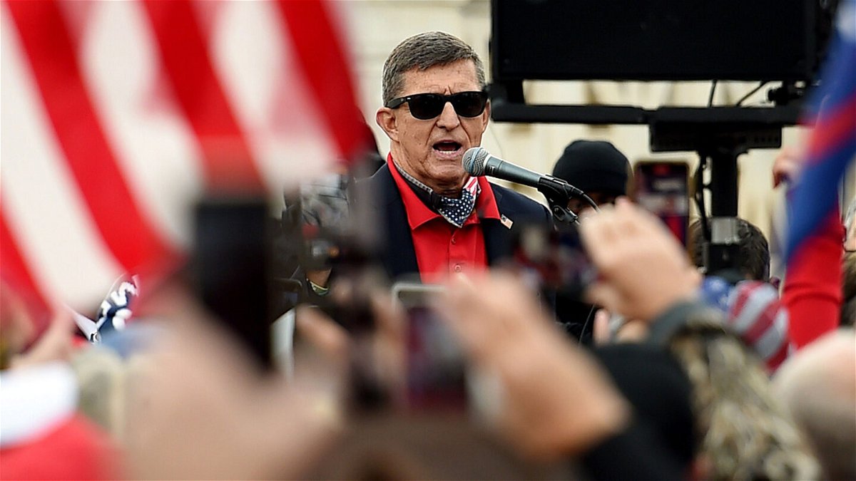 <i>Olivier Douliery/AFP via Getty Images</i><br/>Former national security adviser Michael Flynn speaks at a protest outside the US Supreme Court on in December 2020 in Washington