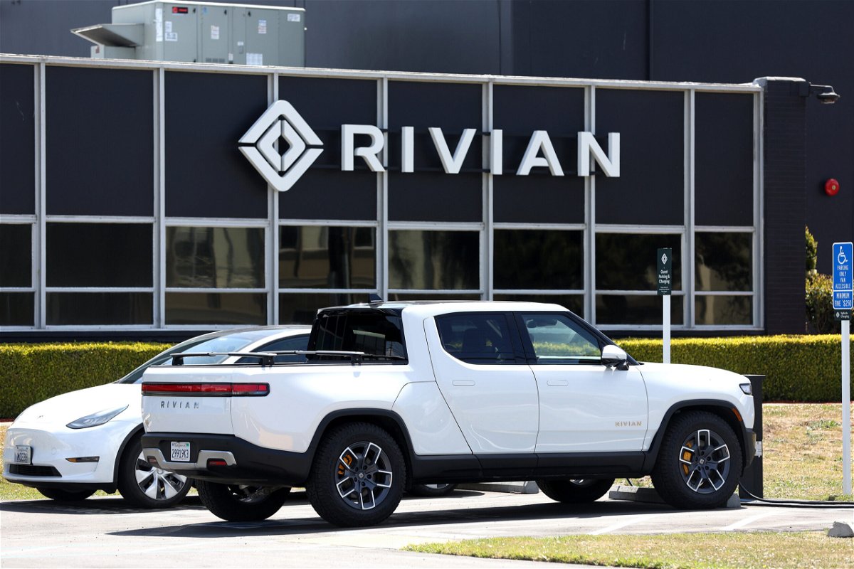<i>Justin Sullivan/Getty Images</i><br/>A Rivian electric pickup truck sits in a parking lot at a Rivian service center on May 9