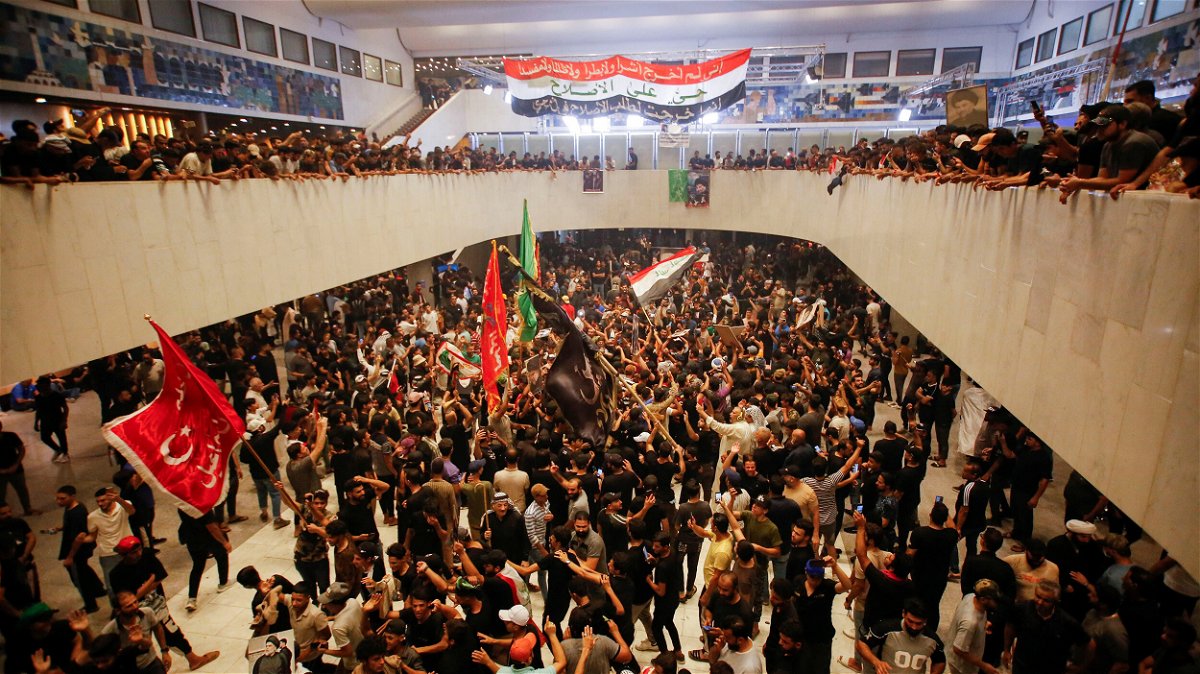 <i>Saba Kareem/Reuters</i><br/>Supporters of populist leader Moqtada al-Sadr gather during a sit-in at Iraq's parliament in Baghdad on July 31.