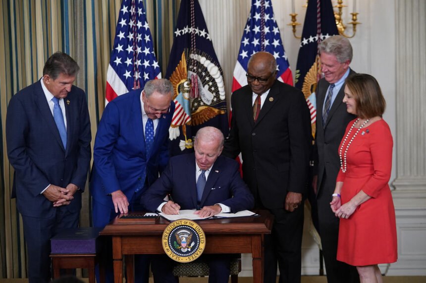 President Joe Biden signs into law the Inflation Reduction Act of 2022 during a ceremony in the State Dining Room of the White House in Washington