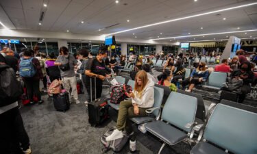 Travelers wait for their flight at Los Angeles International Airport. According to the flight tracking website