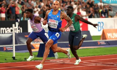 Jacobs crosses the finish line during the men's 100m final at the 2022 European Championships on August 16.