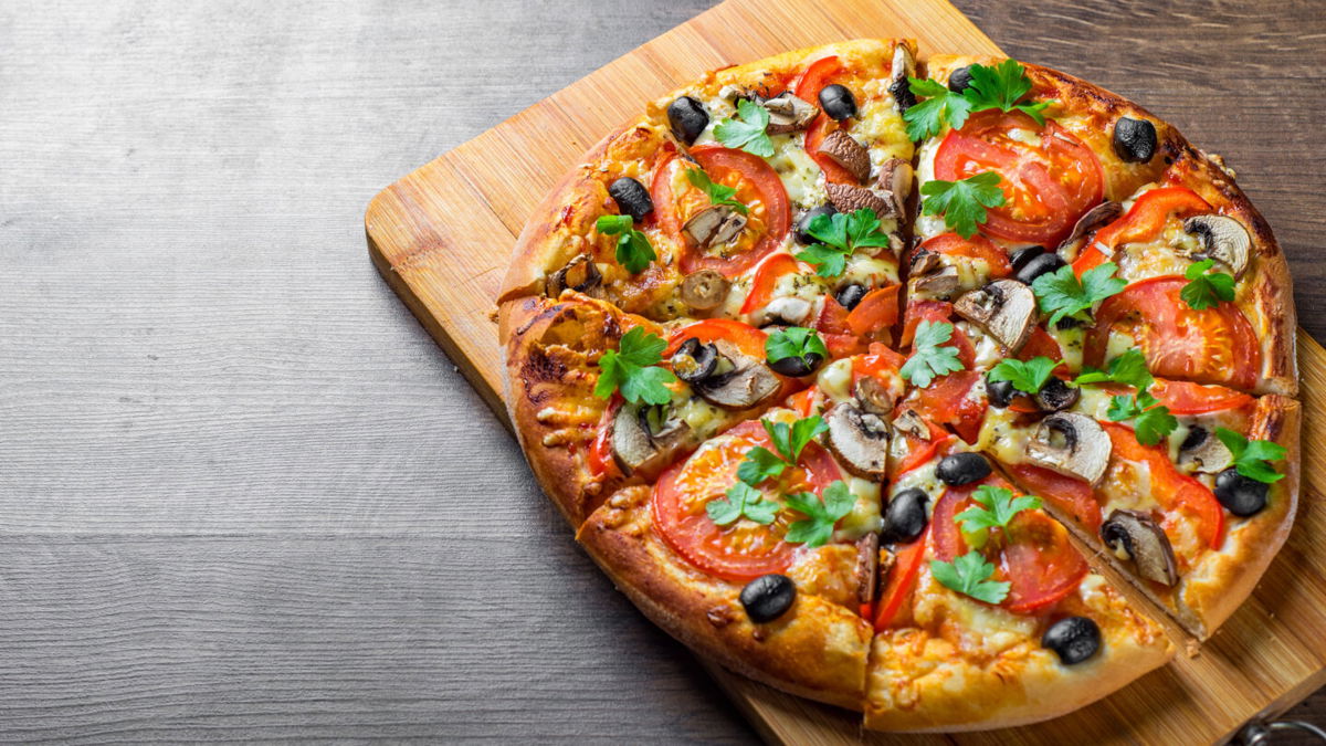<i>pavel siamionov/Adobe Stock</i><br/>Pizza with olives and mushrooms is a no-go for people who find the two ingredients especially objectionable.