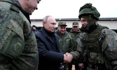 Russia has now announced a stop to its "partial mobilization" of citizens to fight in the country's war on Ukraine. President Vladimir Putin (center) is seen here inspecting a training ground in the Ryazan region on October 20.