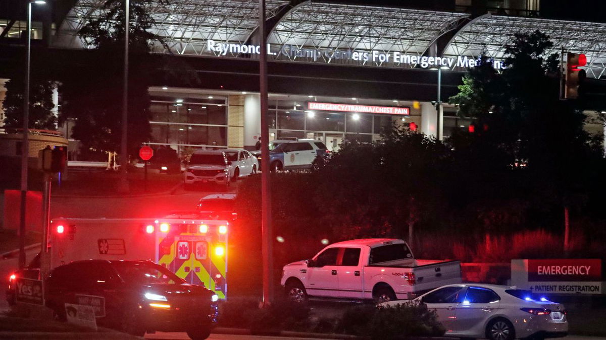 Law enforcement is seen outside a hospital in Raleigh, North Carolina, where victims were being treated on October 13 after a shooting that killed 5 people, according to authorities.
