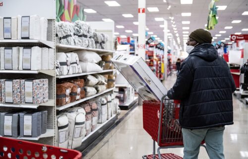 Consumers still don't feel great about their finances. A shopper is pictured at a Target store on Black Friday in Chicago