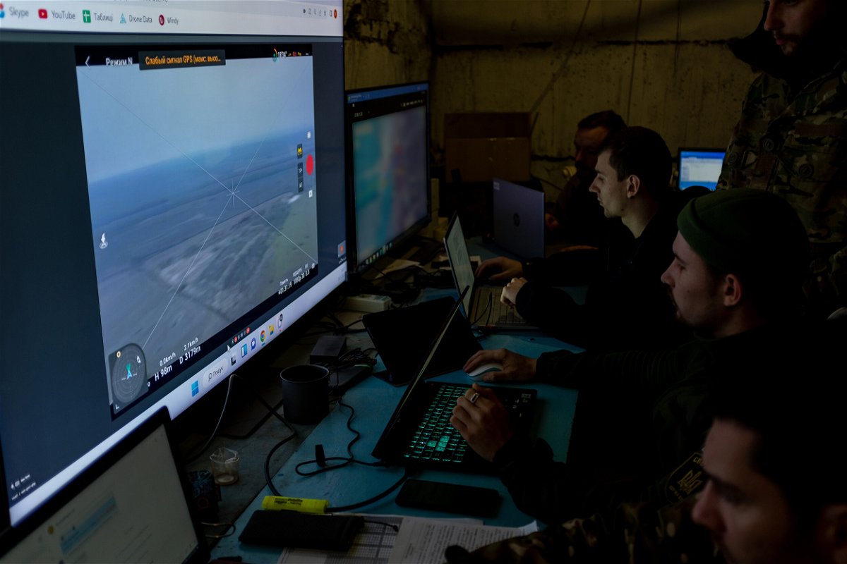 <i>Mick Krever/CNN</i><br/>Ukrainian soldiers watch a real-time feed from a drone as they target artillery strikes on Russian positions.