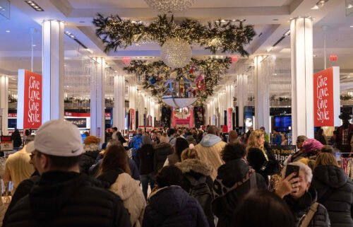 People shop at Macy's department store during Black Friday in New York City on November 25. American consumers got holiday shopping off to a strong start.