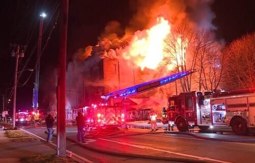 Parts of the roof collapsed as firefighters in Rhode Island battled a fire that engulfed a furniture store.