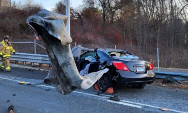 A motorist was “miraculously” left with only minor injuries after a car was impaled by a guardrail in Manchester