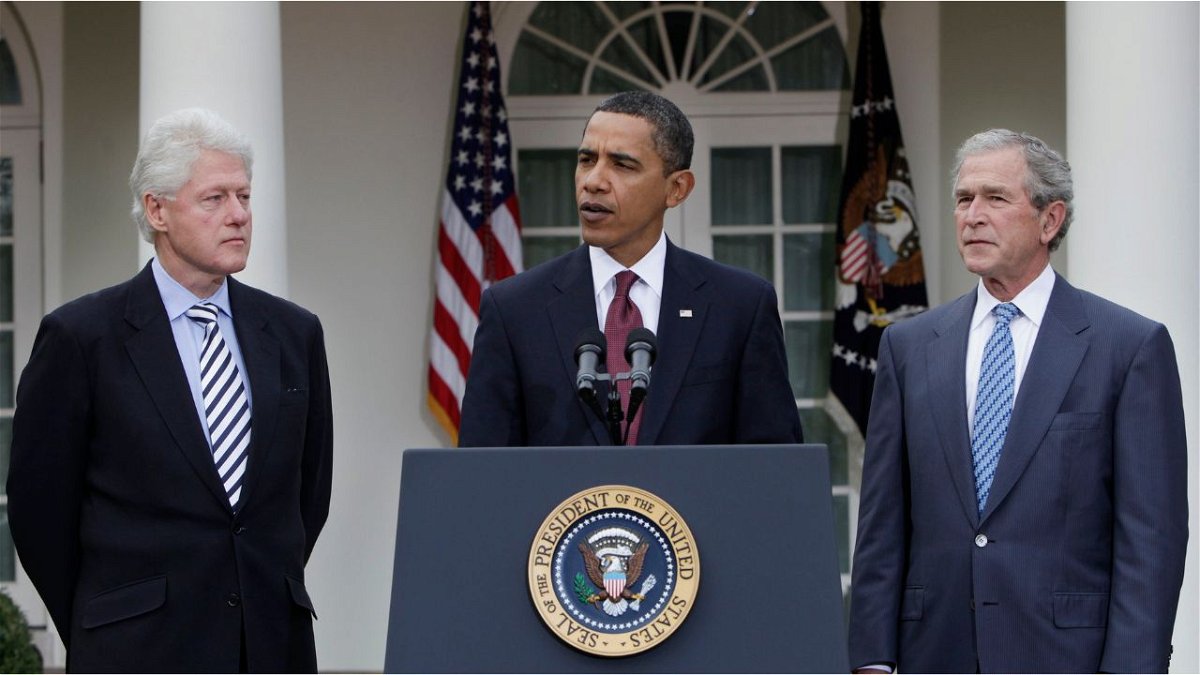 President Barack Obama (center) speaks as former Presidents Bill Clinton (left) and George W. Bush (right) listen in the Rose Garden at the White House in January of 2010.
