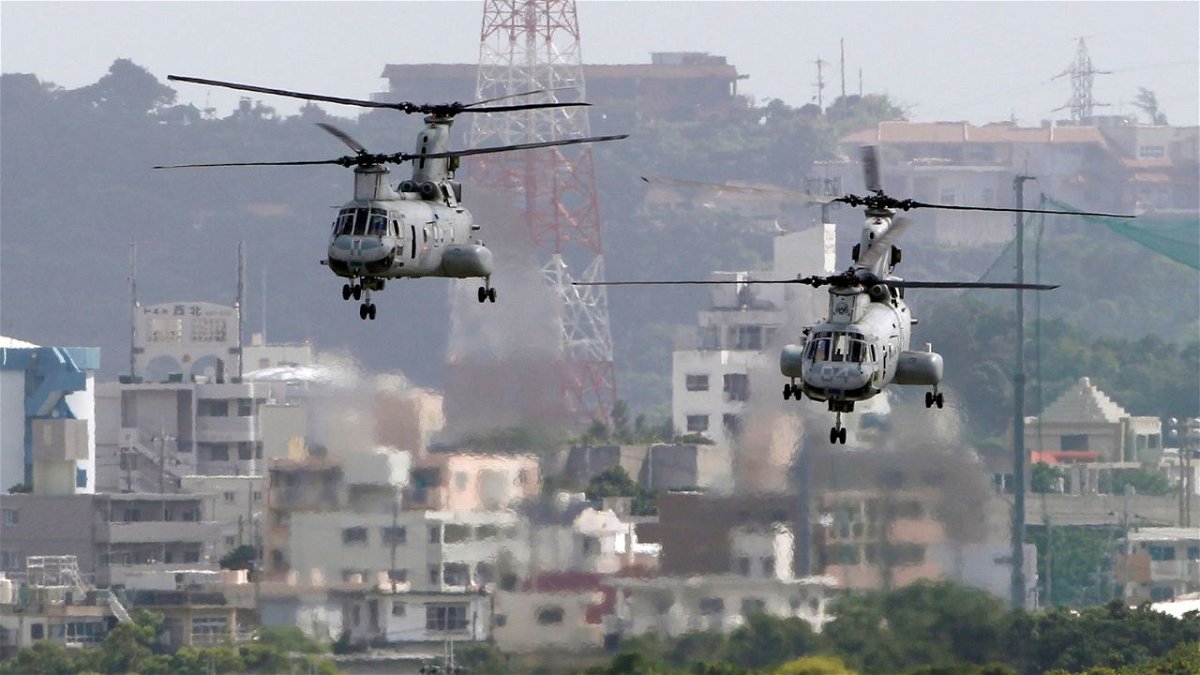 The United States and Japan are strengthening their military relationship to deter China. In this 2012 file photo, CH-46 helicopters take off from the US Marine Corps base in Okinawa, Japan.
