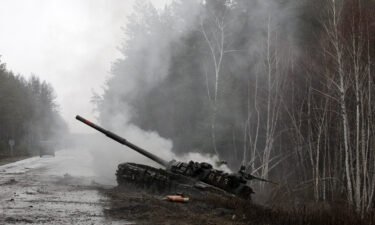 Smoke rises from a Russian tank destroyed by Ukrainian forces
