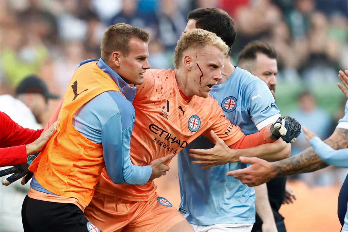 <i>Darrian Traynor/Getty Images</i><br/>Melbourne Victory FC hit with record sanctions after the ugly pitch invasion in December 2022. Melbourne City goalkeeper Tom Glover was left bloodied after fans invaded the pitch.