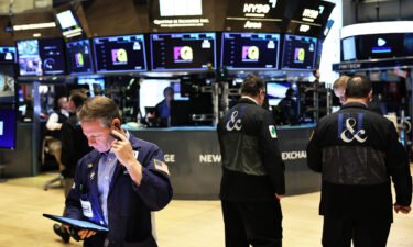 The Dow plummeted nearly 400 points on Thursday as strong jobs data spooked investors. Pictured is the New York Stock Exchange on December 06