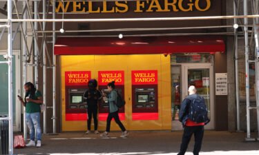 People walk past a Wells Fargo Bank in June of 2022 in New York City.