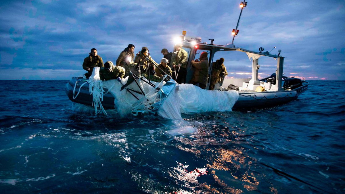 Sailors assigned to Explosive Ordnance Disposal Group 2 recover debris from a high-altitude surveillance balloon off the coast of Myrtle Beach, South Carolina, on February 5.
