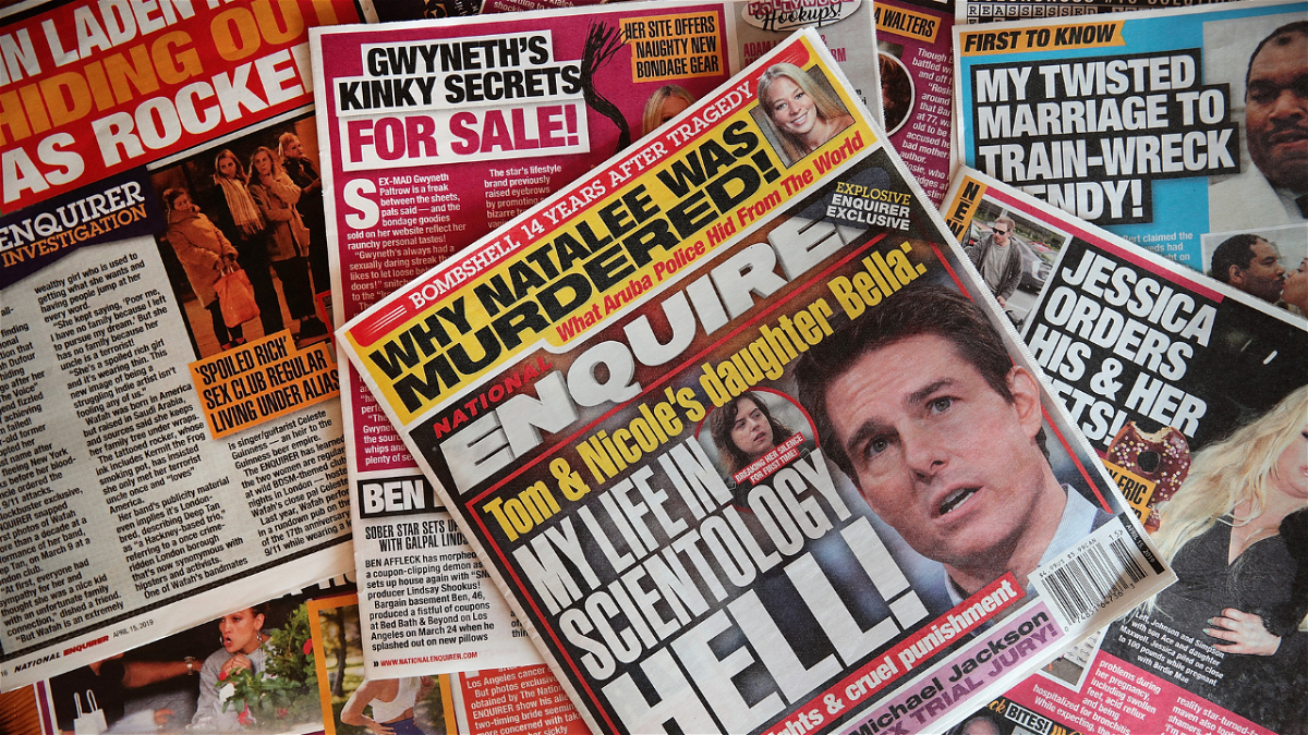 In this photo illustration, celebrity gossip dominates the cover of a National Enquirer magazine on April 11, 2019 in Chicago, Illinois. American Media Inc., the parent company of the National Enquirer has put the magazine and some of their other tabloids up for sale.