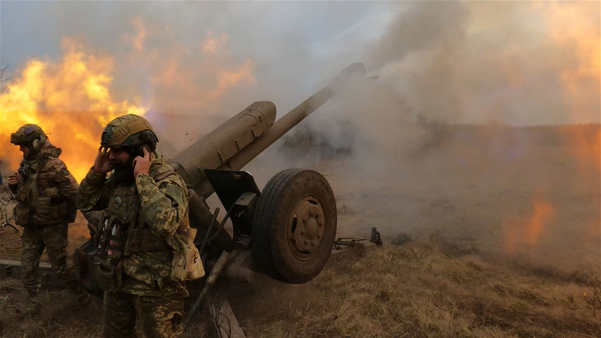 Ukrainian troops fire a D-30 howitzer at Russian positions near Bakhmut, where heavy fighting has taken place for weeks.
