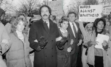 Randall Robinson (center) is seen here during a demonstration against South African government's apartheid policies at the South African Embassy in Washington