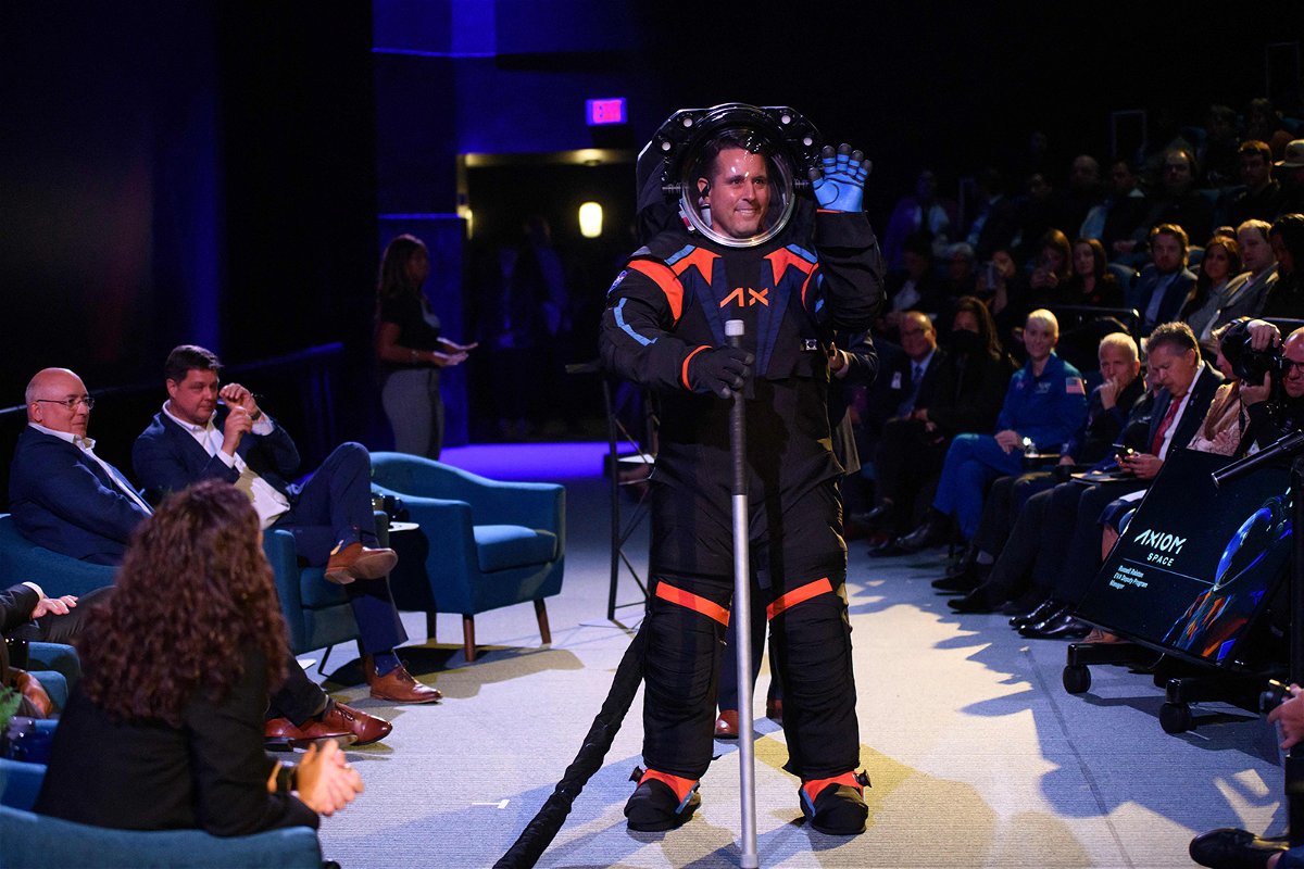 <i>Mark Felix/AFP/Getty Images</i><br/>Axiom Chief Engineer Jim Stein wears the new spacesuit during the Axiom Space Artemis III Lunar Spacesuit event at Space Center Houston on March 15.