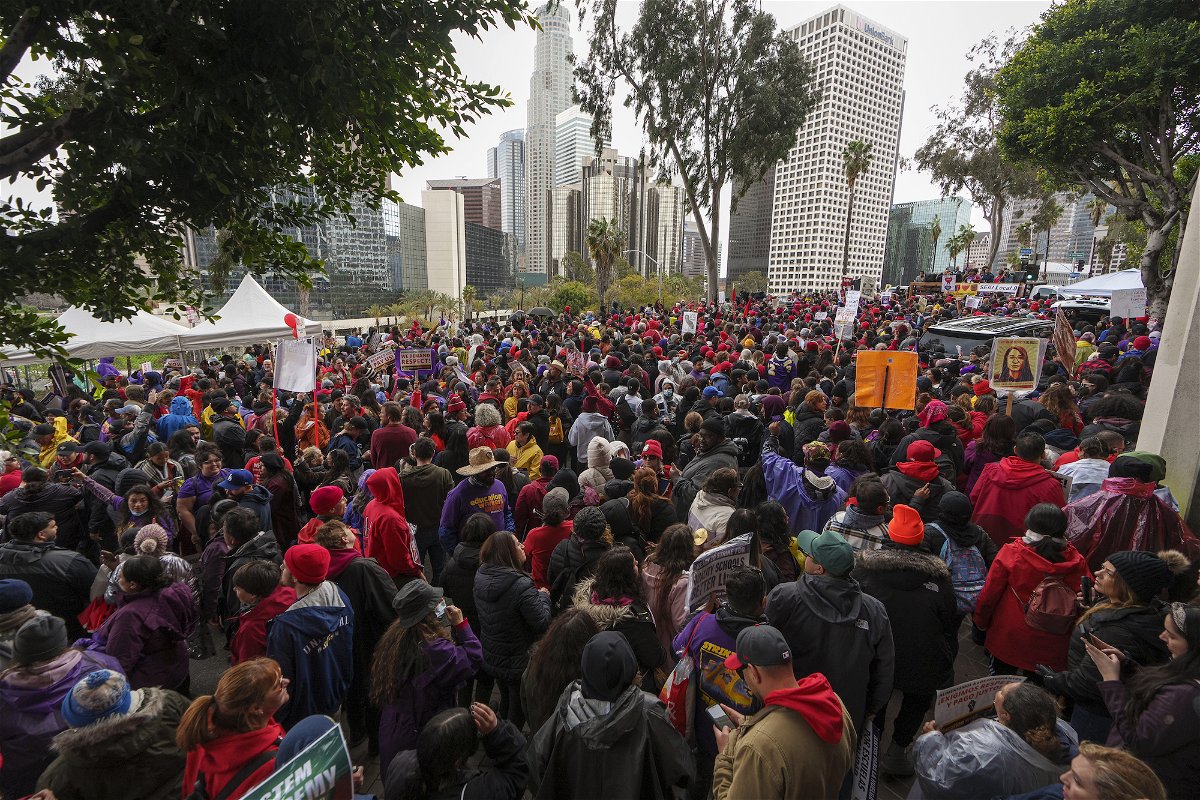 <i>Damian Dovarganes/AP</i><br/>Thousands of school workers and their supporters rally outside the LAUSD headquarters in Los Angeles on Tuesday.