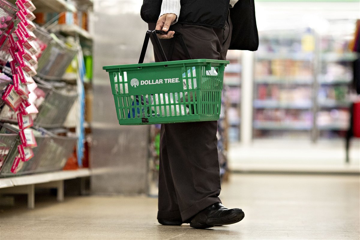 A shopper carries a basket inside a Dollar Tree store in Chicago