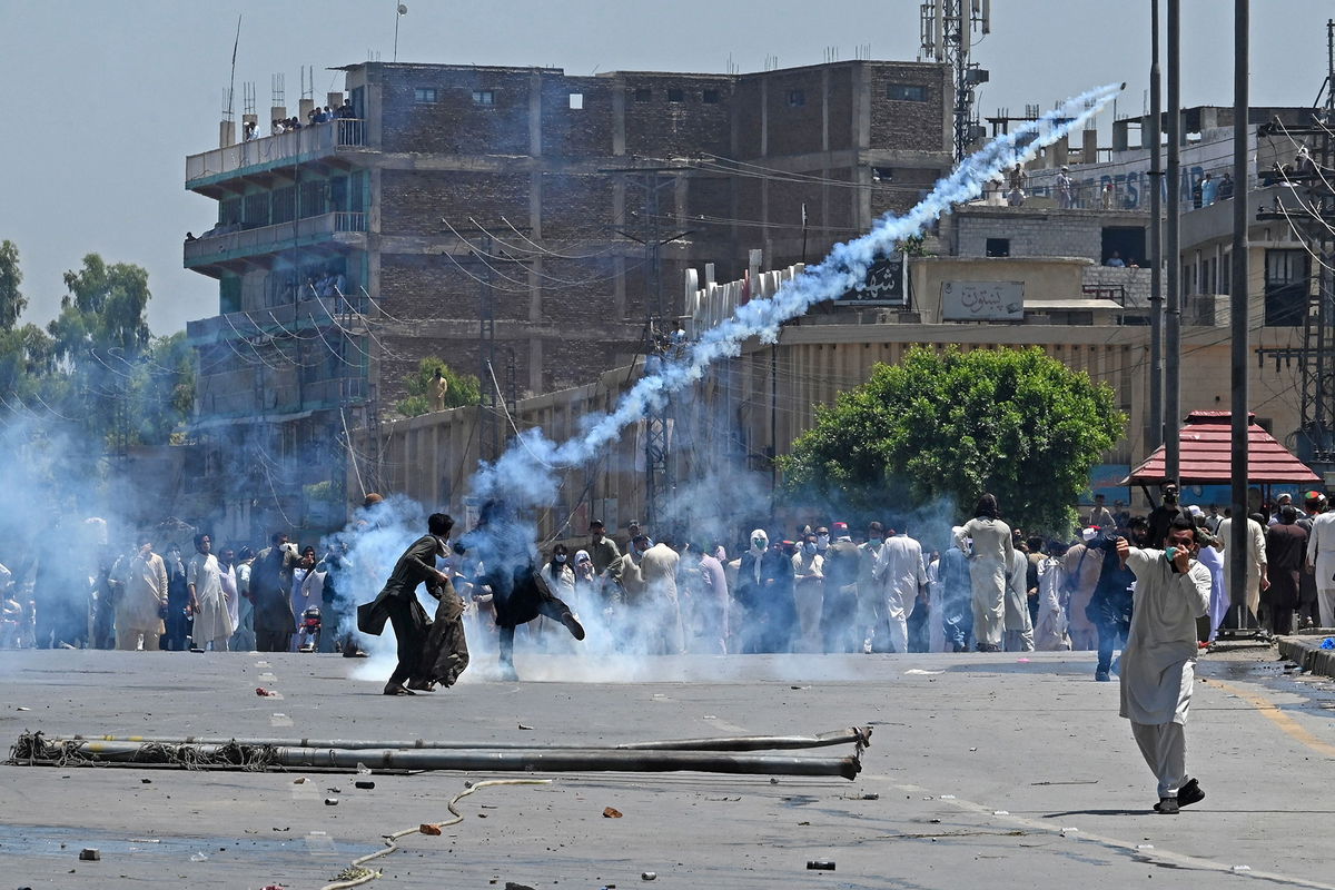 Pakistan Tehreek-e-Insaf (PTI) supporters clash with police during a protest against the arrest of former prime minister Imran Khan in Peshawar on May 10.
