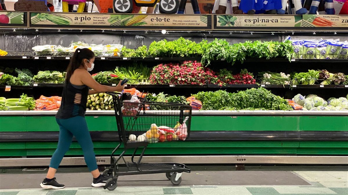 <i>Justin Sullivan/Getty Images</i><br/>A customer shops for produce at a Cardenas Market on June 8