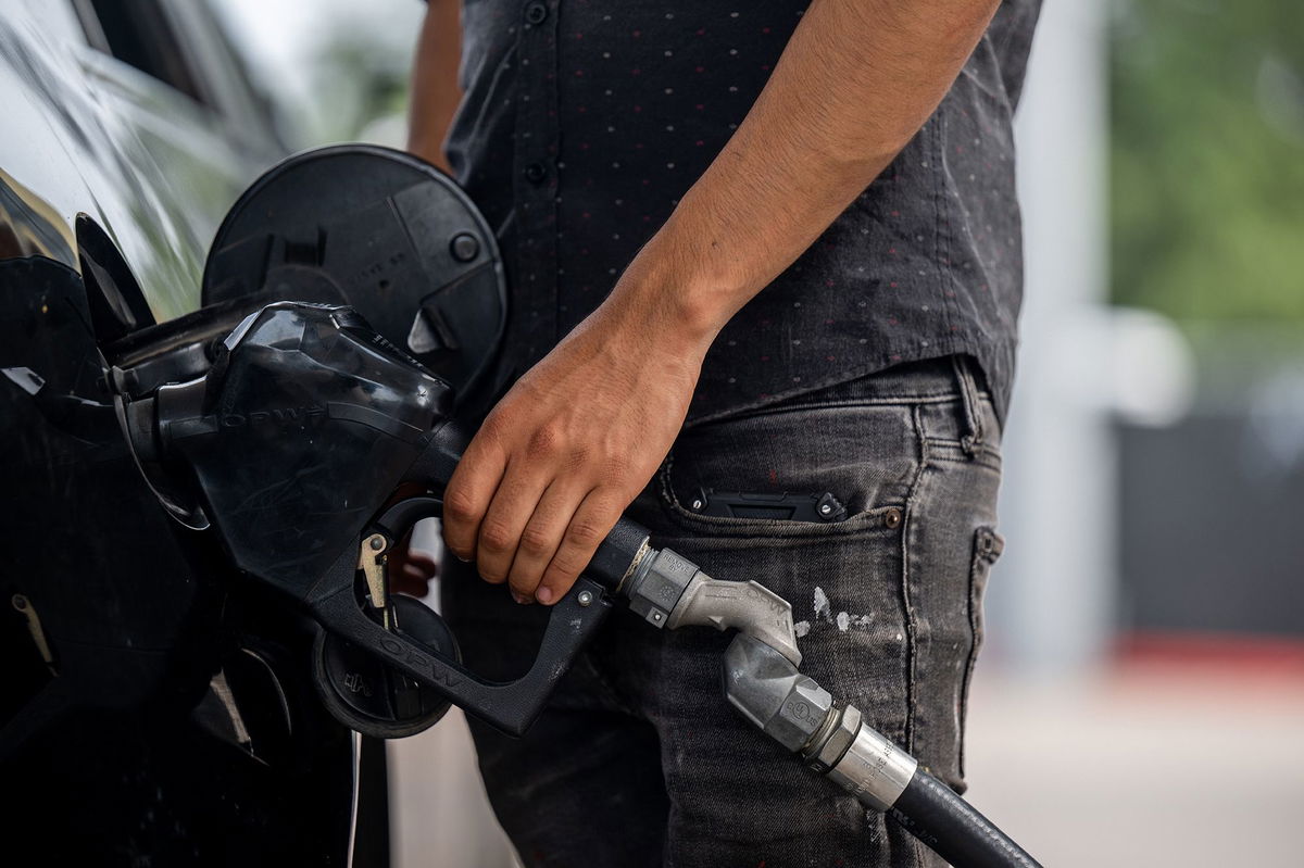 A person pumps gas at a Chevron gas station on May 26 in Austin, Texas.
