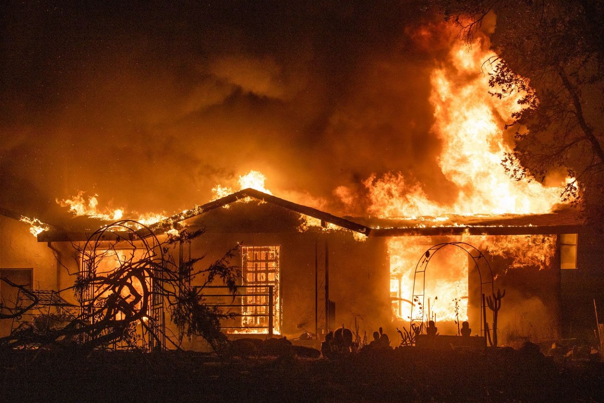 <i>Ethan Swope/AP/File</i><br/>A house burns on Platina Road at the Zogg Fire near Ono